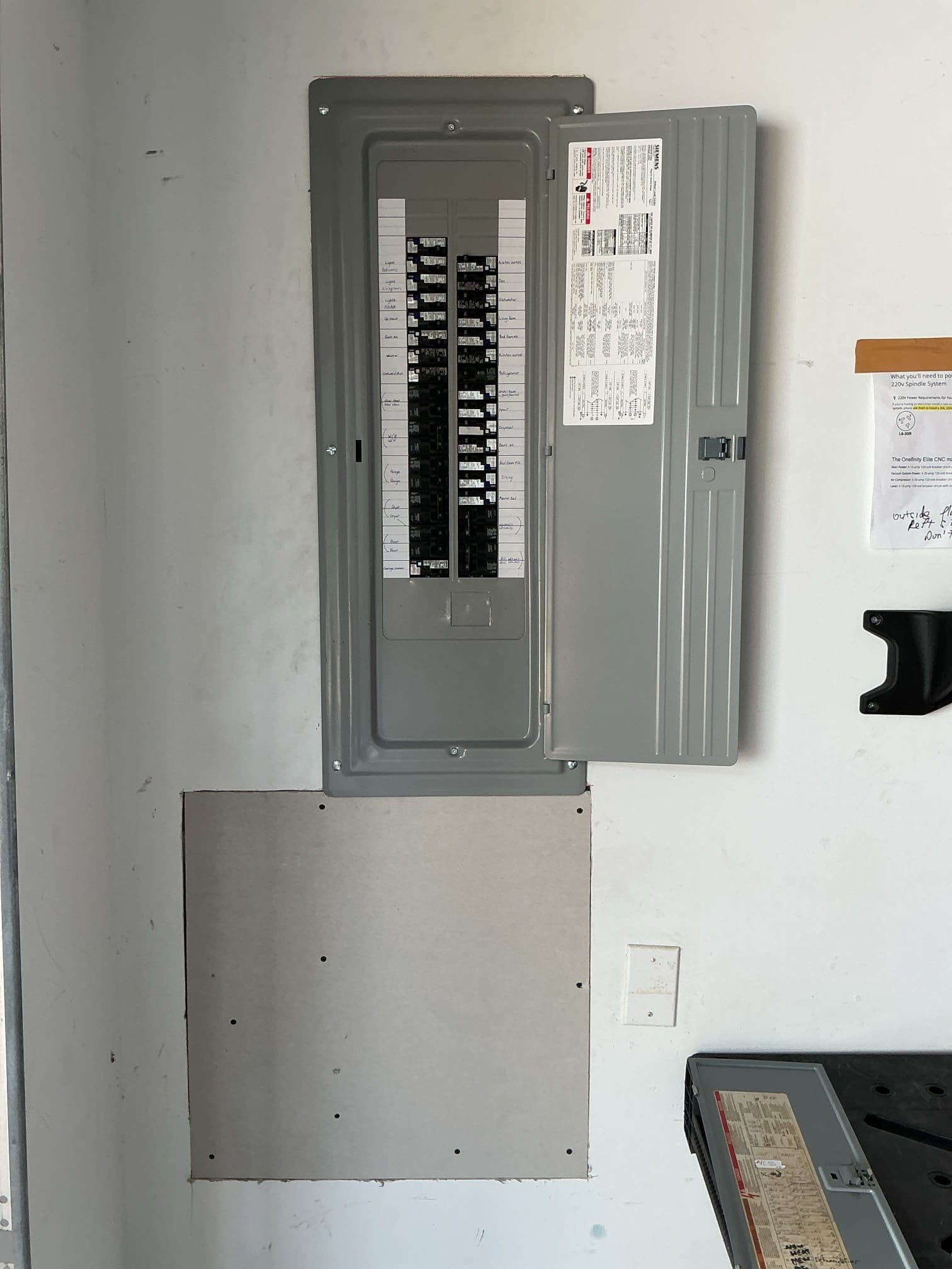 Efficient New Electrical Panel Installation in Local Garage image