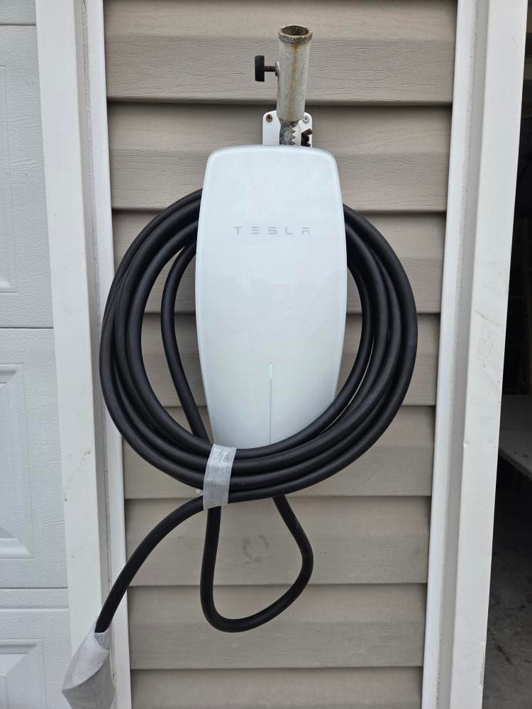 Tesla Wall Connector Installed and Hardwired on Home Exterior image